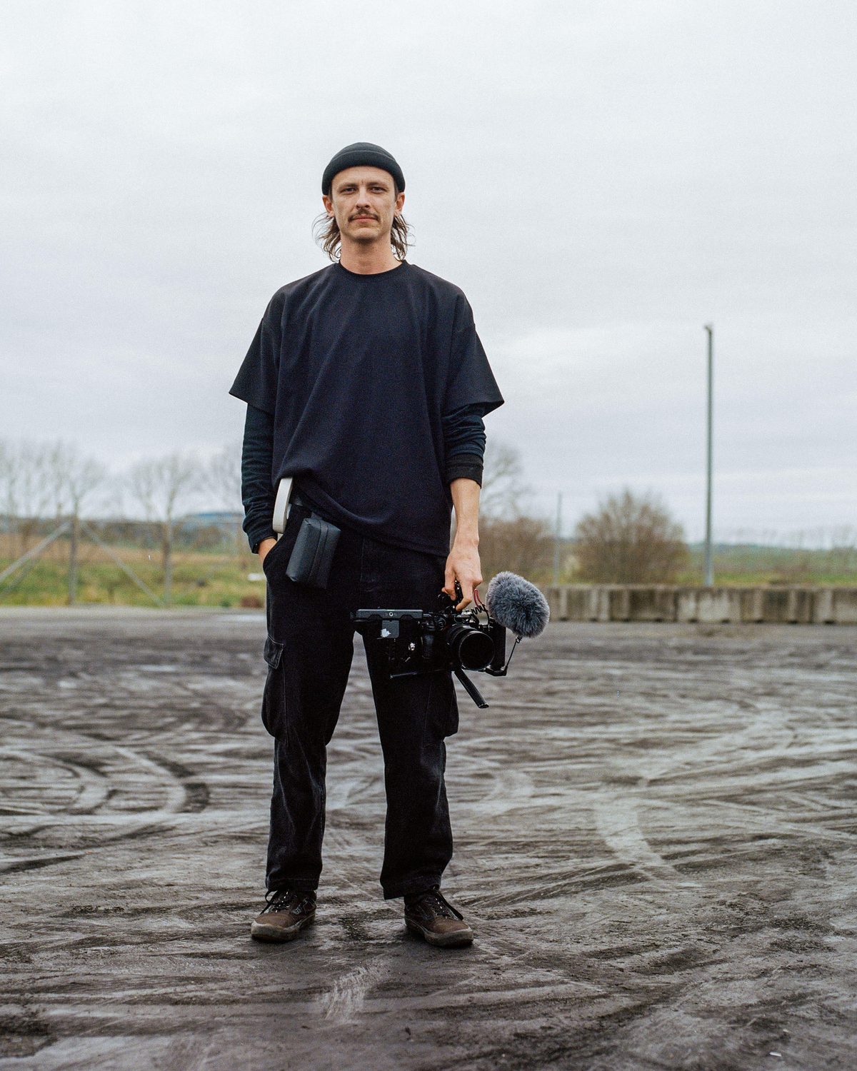 Isaac Lyon holding a camera rig on a drift pad